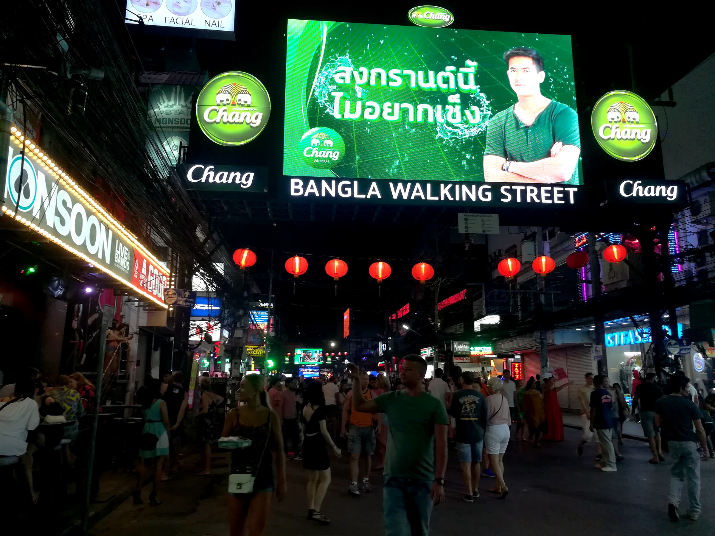 Bangla Road at night with pedestrians and vibrant neon lighting